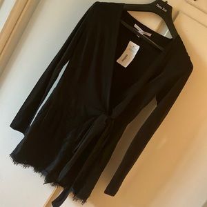 Bodysuit shorts and top with zipper on left side and ties on the left side also.